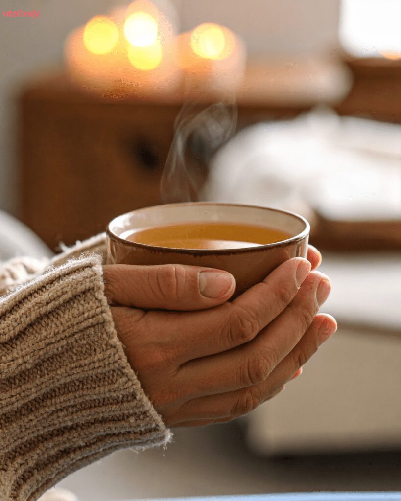 Holding a cup of tea in hands