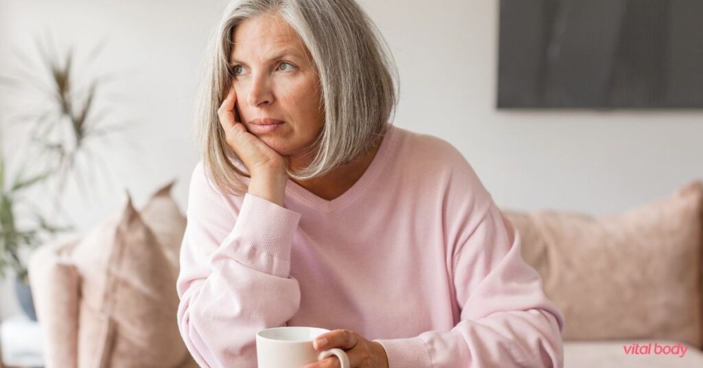 Woman on her couch with a cup of coffee, thinking about her weight loss options